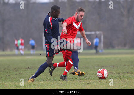 Shakespeare (red) vs MDM United - Hackney & Leyton Sunday League Football at South Marsh, Hackney Marshes, London - 15/02/15 Stock Photo