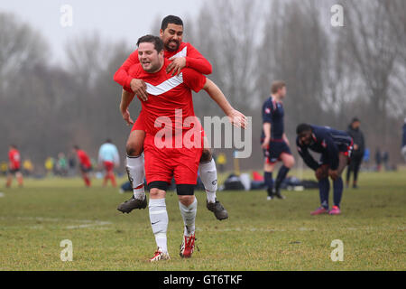 Shakespeare (red) vs MDM United - Hackney & Leyton Sunday League Football at South Marsh, Hackney Marshes, London - 15/02/15 Stock Photo