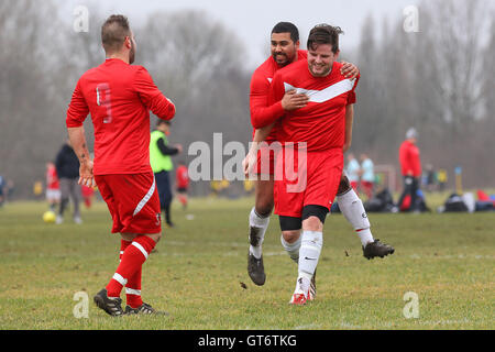 Shakespeare (red) vs MDM United - Hackney & Leyton Sunday League Football at South Marsh, Hackney Marshes, London - 15/02/15 Stock Photo