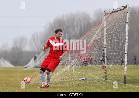 Shakespeare (red) vs MDM United - Hackney & Leyton Sunday League Football at South Marsh, Hackney Marshes, London - 15/02/15 Stock Photo