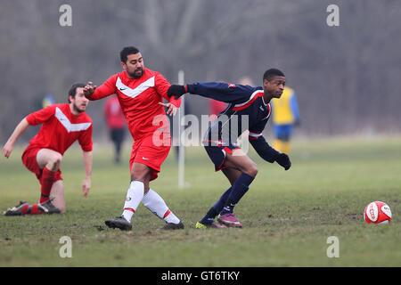 Shakespeare (red) vs MDM United - Hackney & Leyton Sunday League Football at South Marsh, Hackney Marshes, London - 15/02/15 Stock Photo