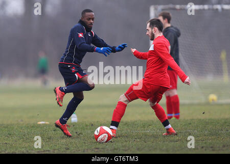 Shakespeare (red) vs MDM United - Hackney & Leyton Sunday League Football at South Marsh, Hackney Marshes, London - 15/02/15 Stock Photo