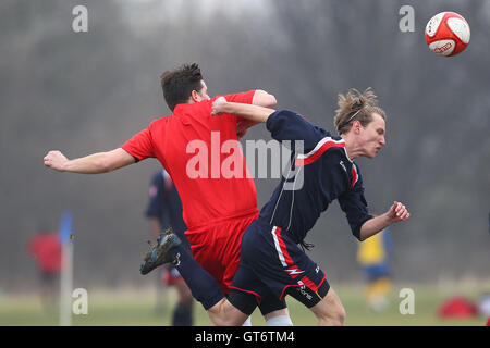 Shakespeare (red) vs MDM United - Hackney & Leyton Sunday League Football at South Marsh, Hackney Marshes, London - 15/02/15 Stock Photo