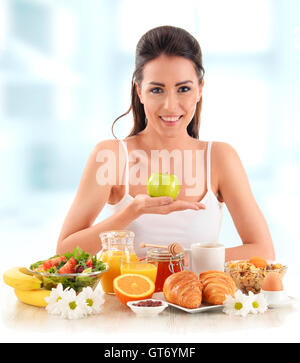 Young woman having breakfast. Balanced diet. Stock Photo