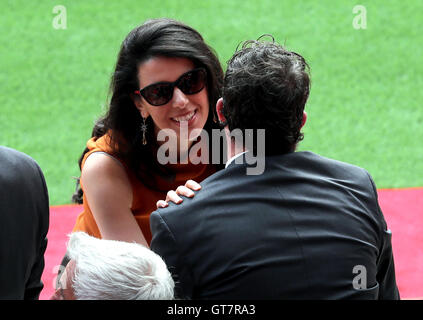 Former Liverpool player Robbie Fowler is greeted by Linda Pizzuti wife of Liverpool owner John W Henry during the opening of the Anfield Main Stand, Liverpool. Stock Photo