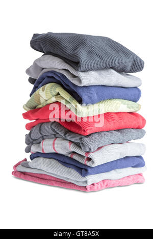 Close up Folded Assorted Clean Clothes in One Pile Isolated on White Background Stock Photo