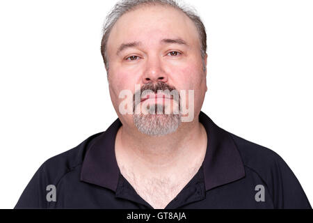 Sombre looking middle-aged man staring at the camera with a thoughtful expression, isolated on white Stock Photo