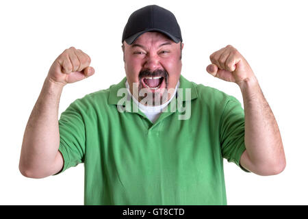 Close up Aggressive Bearded Middle Aged Man in Casual Green Polo Shirt and Black Cap, Yelling Out Loud with Fists Raised. Isolat Stock Photo