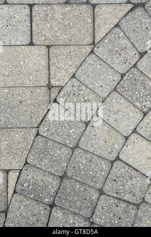 Grey brick paving background pattern and texture a portion of the edge of a circular design with the flooring Stock Photo