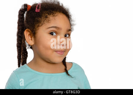 Close up Charming Four Year Old Girl Looking at the Camera Positively Against White Background. Stock Photo