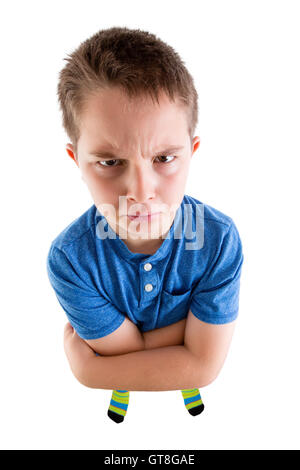 Young Boy Looking at the Camera From High Angle View with Mean Facial Expression. Isolated on White Background. Stock Photo