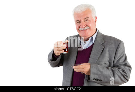 Half Body Shot of a Senior Businessman Holding a Glass of Turkish Tea and Smiling at the Camera Against White Background. Stock Photo