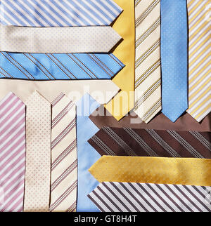 Group of pastel colored neckties, layered and overlapping, studio shot Stock Photo
