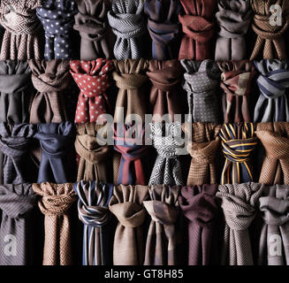 Close-up of rows of coloured and knotted scarves Stock Photo