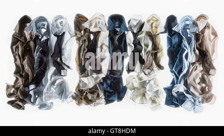 Group of multi coloured shirts on white background Stock Photo