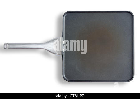 High Angle View of Well-Used Discolored Non Stick Square Pan with Handle, Still Life on White Background with Copy Space Stock Photo