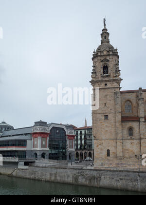 San Anton church tower and Mercado de la Ribera by Bilbao ria Stock Photo