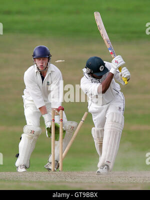 A Krishnan of Ardleigh Green is clean bowled as Wanstead wicket keeper A Joslin looks on - Ardleigh Green CC vs Wanstead CC - Essex Cricket League - 01/09/07 .. Stock Photo