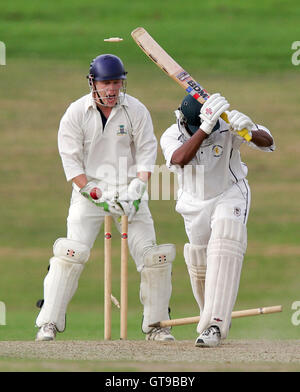 A Krishnan of Ardleigh Green is clean bowled as Wanstead wicket keeper A Joslin looks on - Ardleigh Green CC vs Wanstead CC - Essex Cricket League - 01/09/07 .. Stock Photo