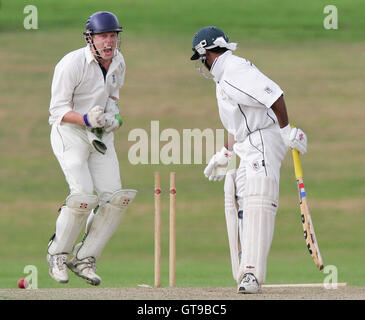 A Krishnan of Ardleigh Green is clean bowled as Wanstead wicket keeper A Joslin looks on - Ardleigh Green CC vs Wanstead CC - Essex Cricket League - 01/09/07 .. Stock Photo