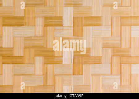 Decorative wooden bamboo texture and pattern of inlaid rectangular blocks on a cutting board in a close up full frame view Stock Photo
