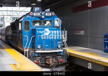 An Metro-North BL20GH diesel locomotive waits with its train in Stamford Station in Stamford, Connecticut. Stock Photo