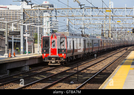 A southbound Metro-North New Haven line commuter train arrives at the station in Stamford, Connecticut. Stock Photo