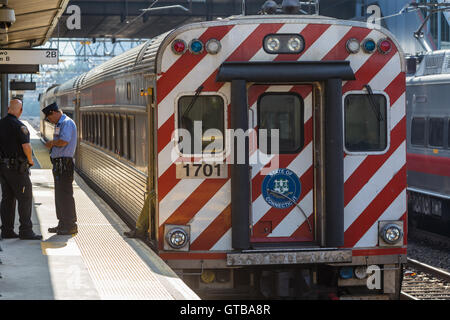 A southbound Metro-North New Haven line commuter train awaits departure from Stamford Station in Stamford, Connecticut. Stock Photo