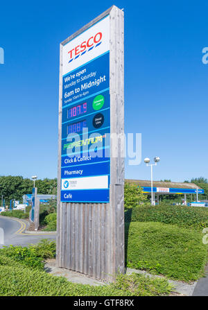 Tesco petrol station price sign at the entrance to the forecourt. Stock Photo