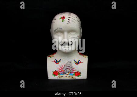 Tattooed porcelain bust Stock Photo
