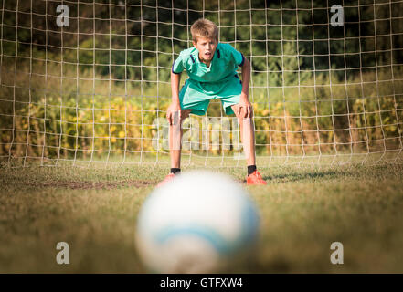 little soccer goalkeeper in goal Stock Photo