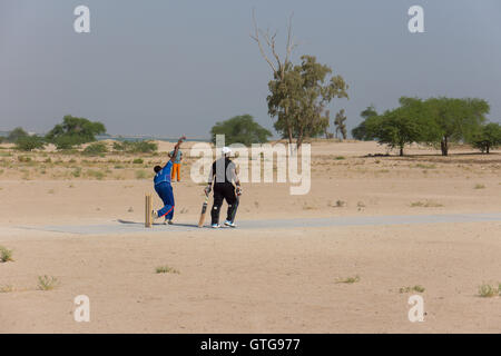 Migrant workers cricket team training in Kuwait Stock Photo