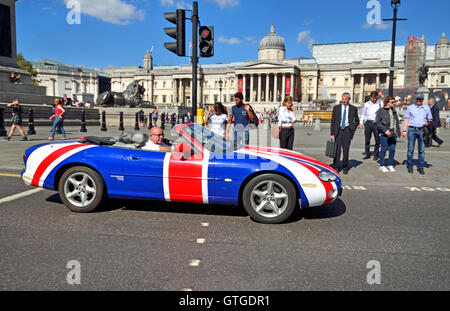 London, England, UK. Union Jack painted Jaguar XK8 convertible sportscar, (owned by Union Jag) in Trafalgar Square Stock Photo