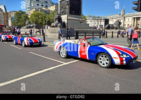 London, England, UK. Union Jack painted Jaguar XK8 convertible sportscars, (owned by Union Jag) in Trafalgar Square Stock Photo