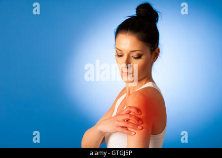 Woman having pain, muscle or chronic nerve pain in her back, sitting on  chair. Diseases of musculoskeletal system, spine, scoliosis, osteoporosis  Stock Photo - Alamy