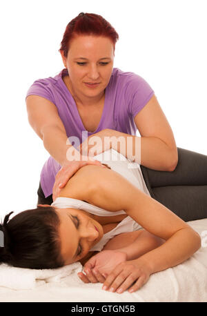 physiotherapy -therapist excercising with patient , working on body and shouder  stretching Stock Photo