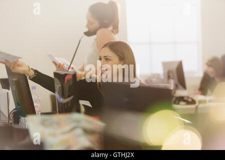 Businesswomen working at computers in office Stock Photo