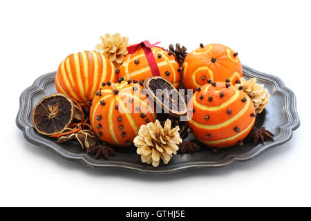 spiced orange pomander balls, scented christmas table decoration isolated on white background Stock Photo