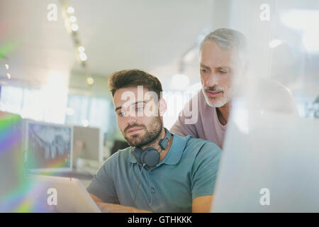 Creative businessmen using digital tablet in office Stock Photo