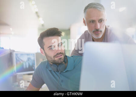 Creative businessmen working at computer in office Stock Photo