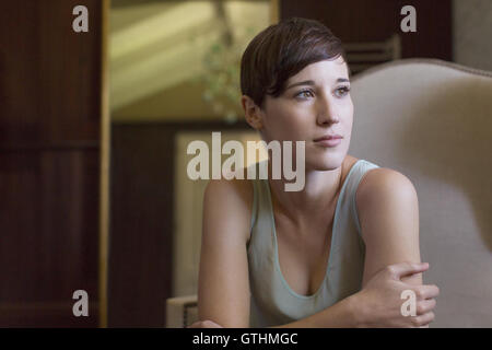 Pensive brunette woman looking away Stock Photo