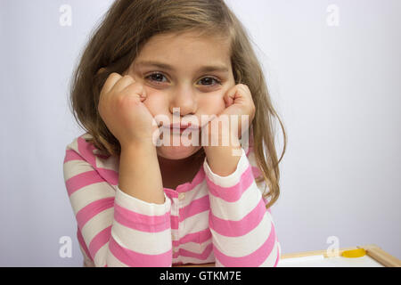 Portrait of a little girl being boring Stock Photo