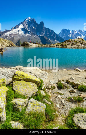 Tourists and walkers at Lac Blanc one of the most popular walks from Chamonix in the French Alps. On Tour de Mont Blanc walk. Stock Photo