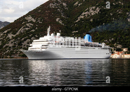 Bay of Kotor, Montenegro -  The cruise ship THOMSON DREAM passing by Perast town on her way to the open sea Stock Photo