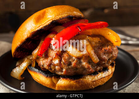 Homemade Sausage Burger with Onions and Peppers Stock Photo