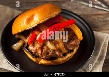 Homemade Sausage Burger with Onions and Peppers Stock Photo