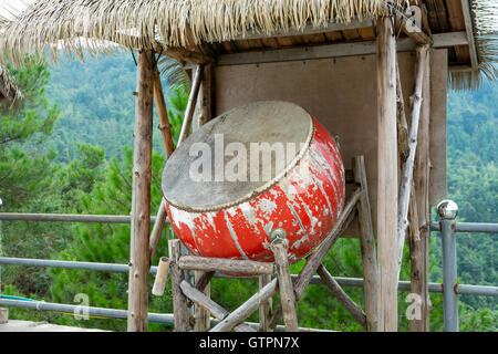 old drum with hay hut Stock Photo