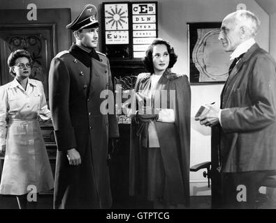 FIRST COMES COURAGE 1943 Columbia film with from left Gretta Grandstedt, Carl Esmond, Merle Oberon, Fritz Leiber Stock Photo