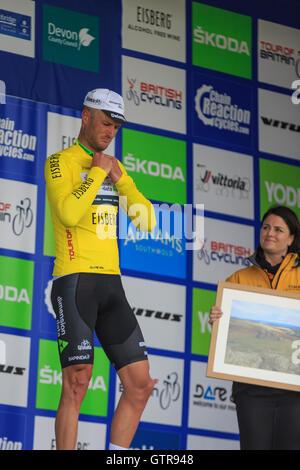 Haytor, Dartmoor, Devon, UK. 09th Sep, 2016. Tour of Britain 2016: Stage 6 - Sidmouth to Haytor. Steve Cummings (Dimension Data) collects the leaders yellow jersey and a framed photo on the podium following Stage 6 of the Tour of Britain. Credit:  Clive Jones/Alamy Live News Stock Photo