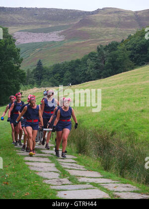 Edale, Derbyshire, UK. 10th September 2016. Competitors race in the annual Great Kinder Beer Barrel Challenge. Begun in 1998 as a result of a bet when local Shepherd Geoff Townsend complained to the landlord of the Old Nag's Head that they had run out of his favourite beer and jokingly agreed to fetch a barrel from the Snake Pass Inn,  over the incredibly steep summit of Kinder Scout in the Peak District. The landlord said if he managed it he could keep the barrel, so Geoff roped in 12 willing assistants and borrowed a mountain rescue stretcher. Credit:  Richard Bradley/Alamy Live News Stock Photo